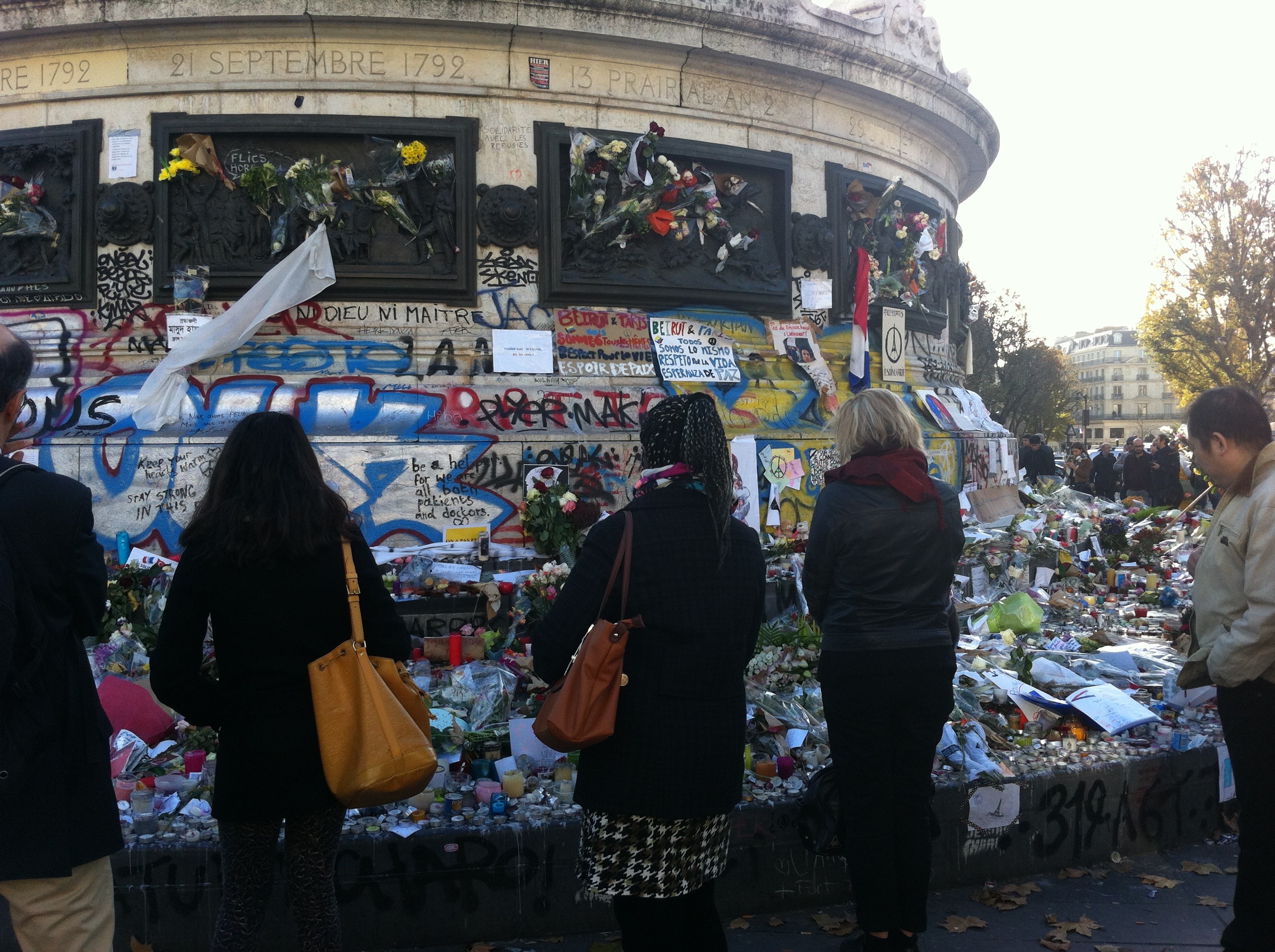 Memorial flowers and notes amass at Place de la Republique after the Nov. 13 attacks.