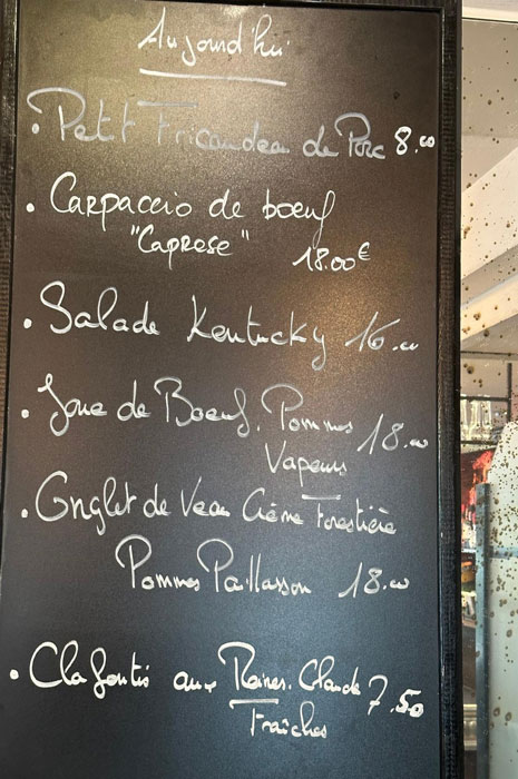 A menu on a blackboard in a Paris Café.